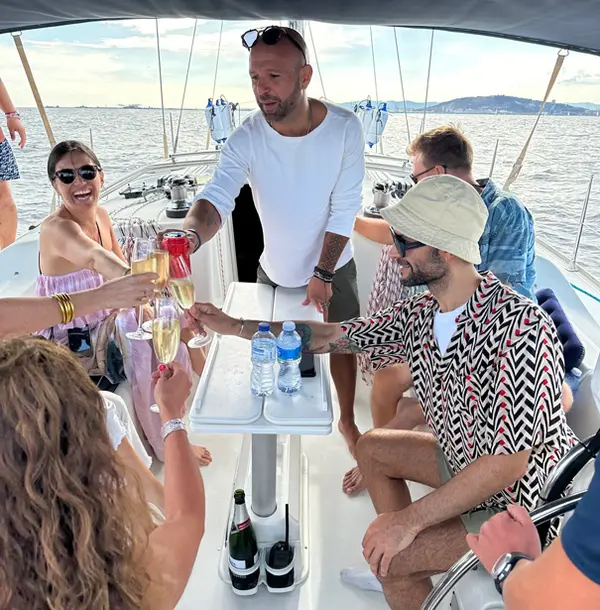 Group of friends laughing together on a private sailing trip in Mallorca